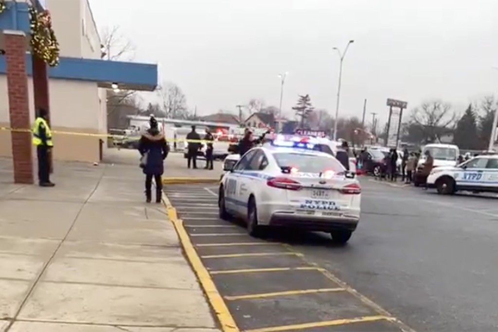 Gunman opens fire on three men sitting in Jeep in Queens,
cops say 1