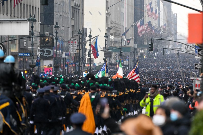 New York Police Show Overwhelming Support at Slain Officer's
Funeral 1