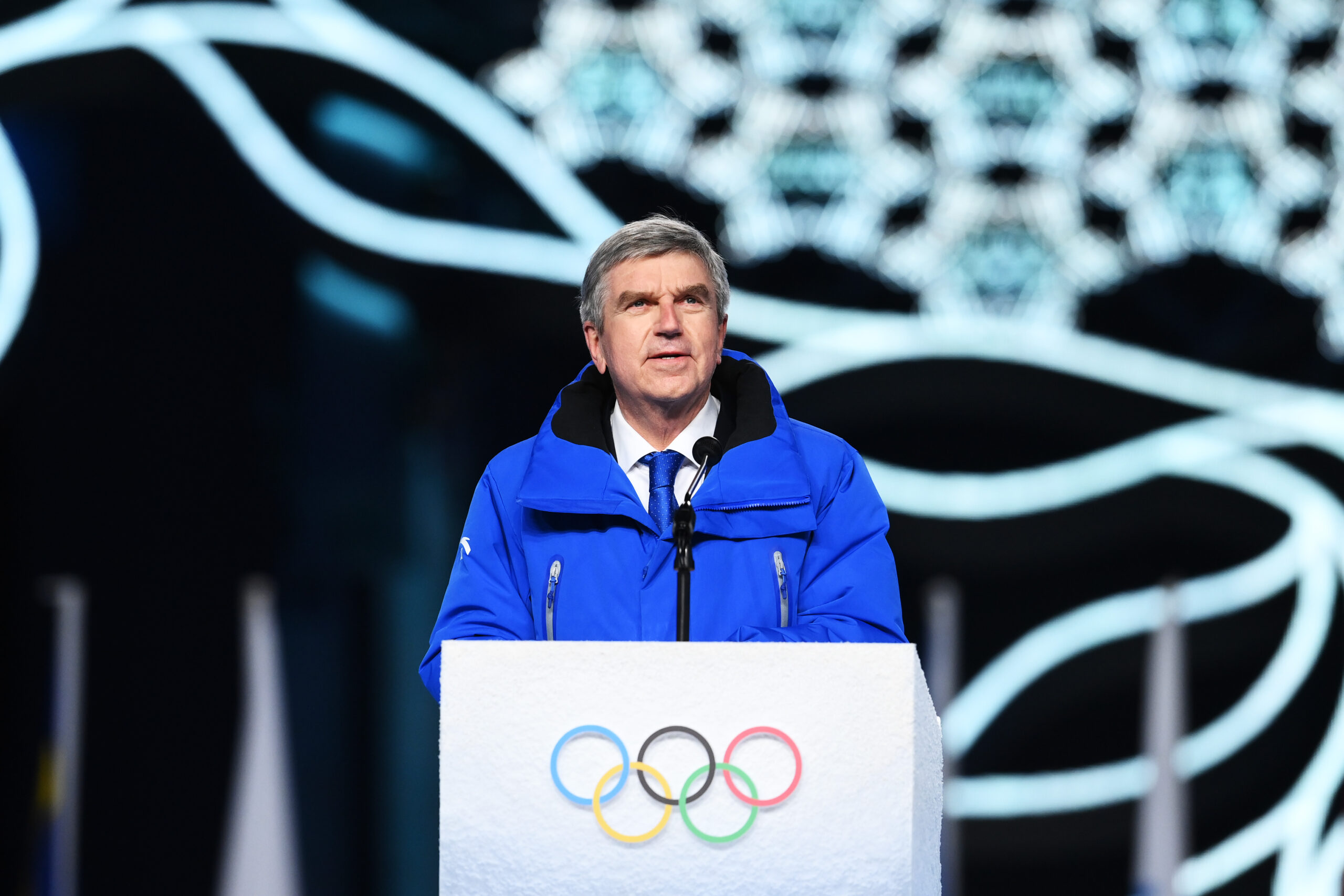 With Putin watching, IOC president opens games with plea to
'give peace a chance' 1