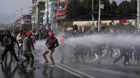 Nepal police fire tear gas, water cannons to disperse
protest over US 'gift' 1