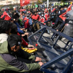 Nepal police fire tear gas to disperse protest over U.S.
grant 5