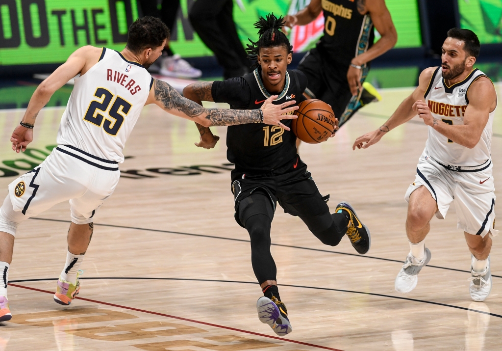 Nuggets open to trading future pick for wing defender,
sources say 1