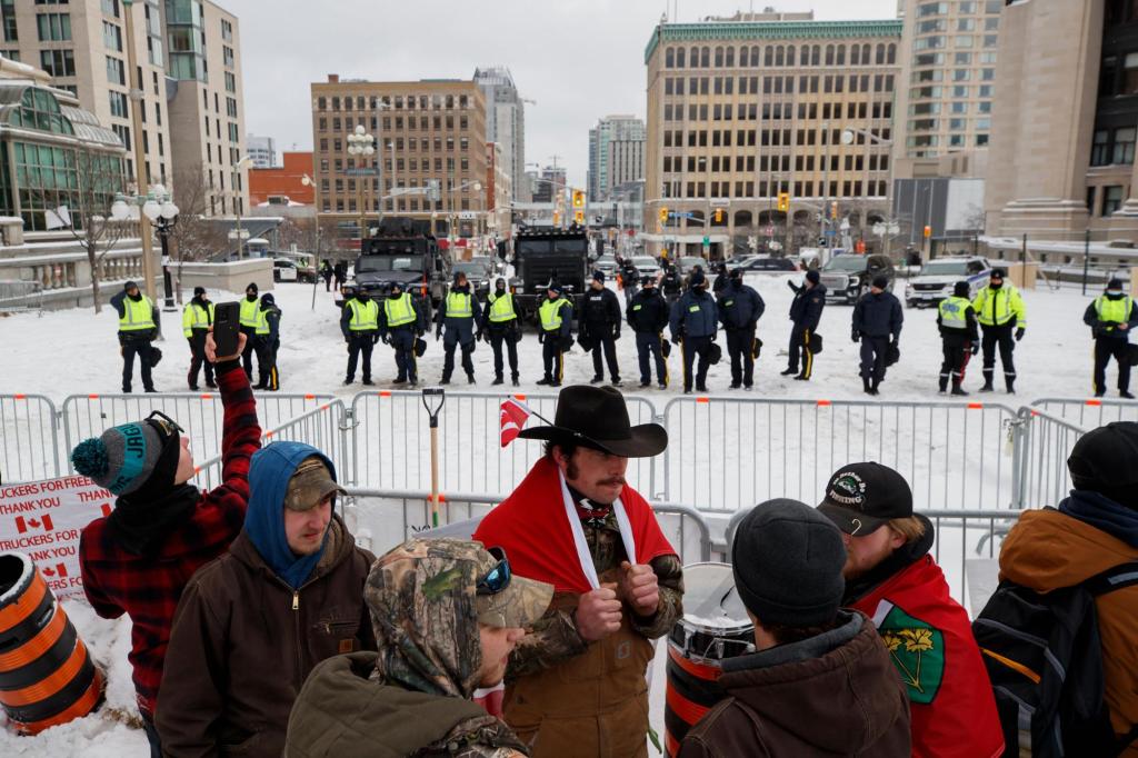 Canada police push back COVID protesters in bid to end
siege 1