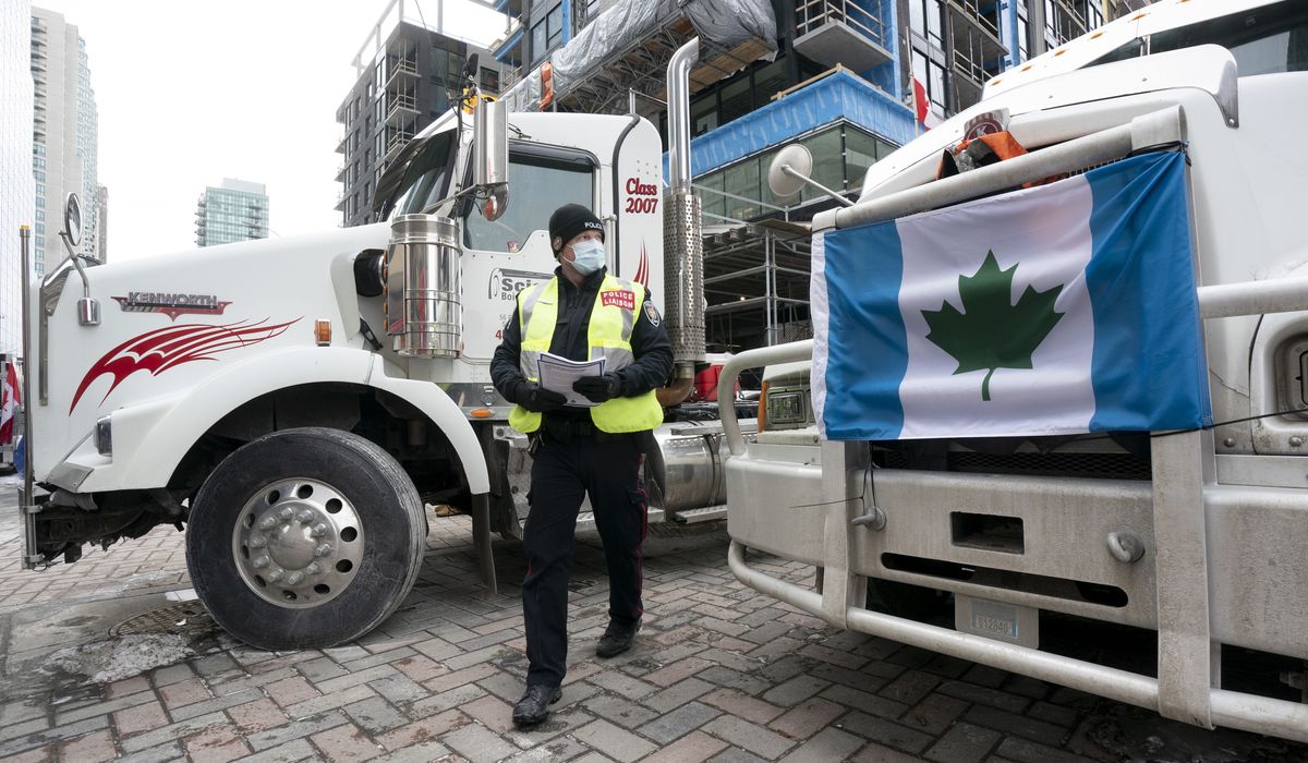 Police warn Ottawa truckers to leave or face arrest, but
protesters remain defiant 1