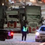 Canadian police arresting protesters, towing rigs in
Ottawa 12