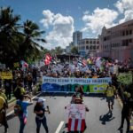 Protests grow in Puerto Rico amid demands for higher
wages 20