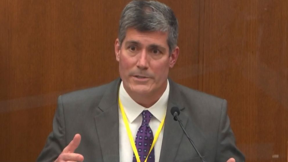 Medical examiner on stand at officers' trial in Floyd
death 1