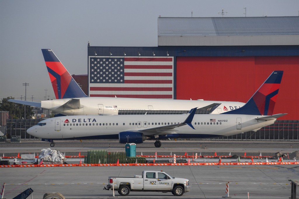Delta passenger tried to open exit door in hopes of sharing
COVID vaccine views 1