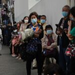 China's leader Xi Jinping urges Hong Kong to get control as
COVID-19 cases surge 9